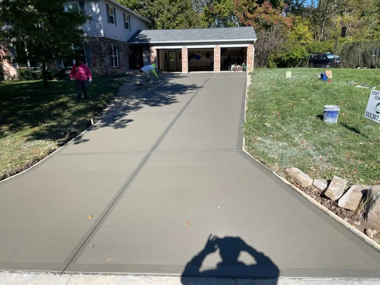 An image of a newly replaced concrete driveway 