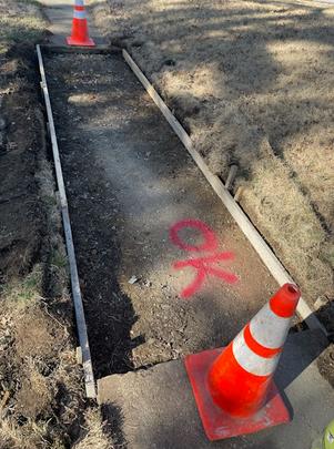 Concrete walkway installation.