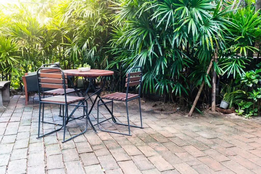 An image of a concrete patio with a table