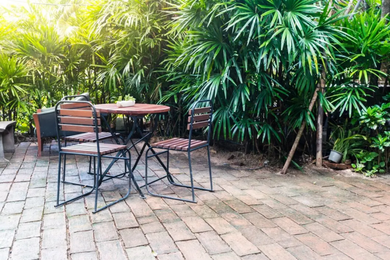 An image of a concrete patio with a table